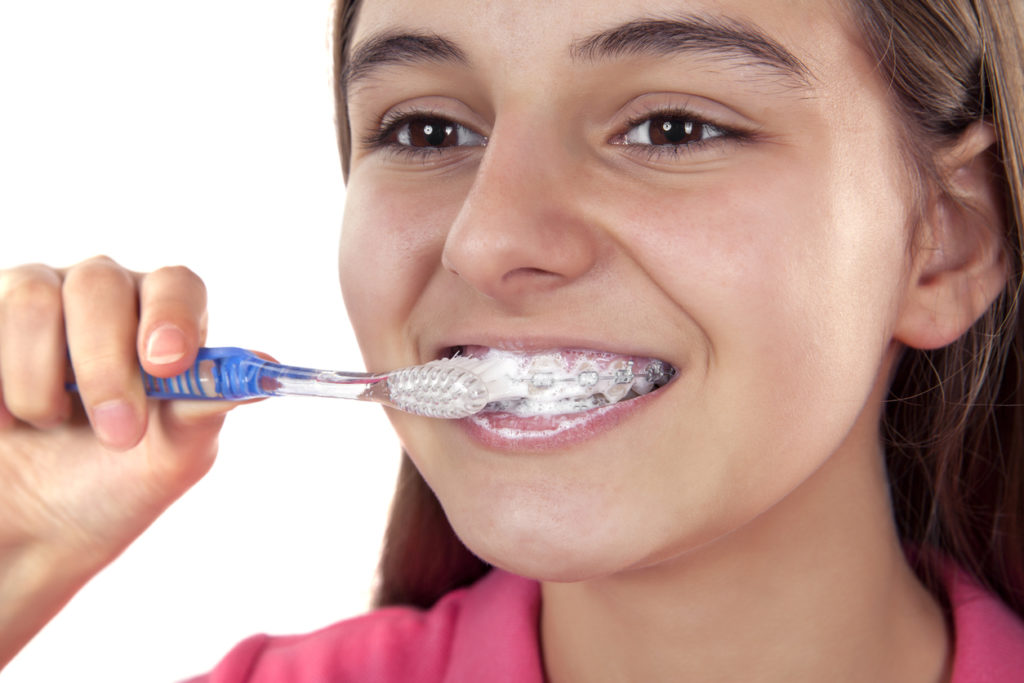 brushing your teeth properly helps with pain from braces